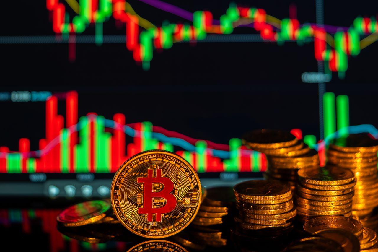 Golden Bitcoin with financial growth graphs, showcasing cryptocurrency market trends.