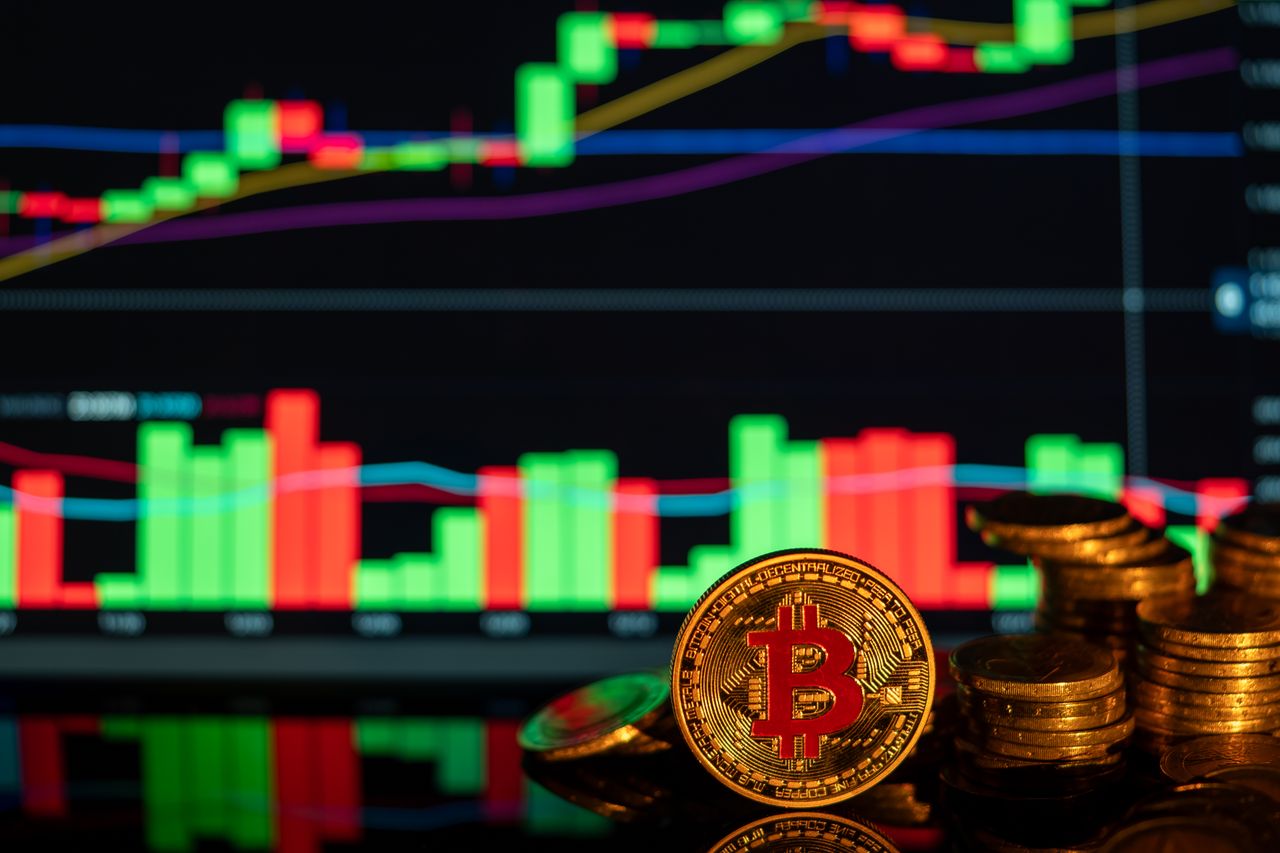 Close-up of Bitcoin coins against a rising financial graph, showcasing cryptocurrency market trends.